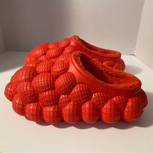 Slippers slides indoor/outdoor Red Bubble shoe with a faux fur lining.